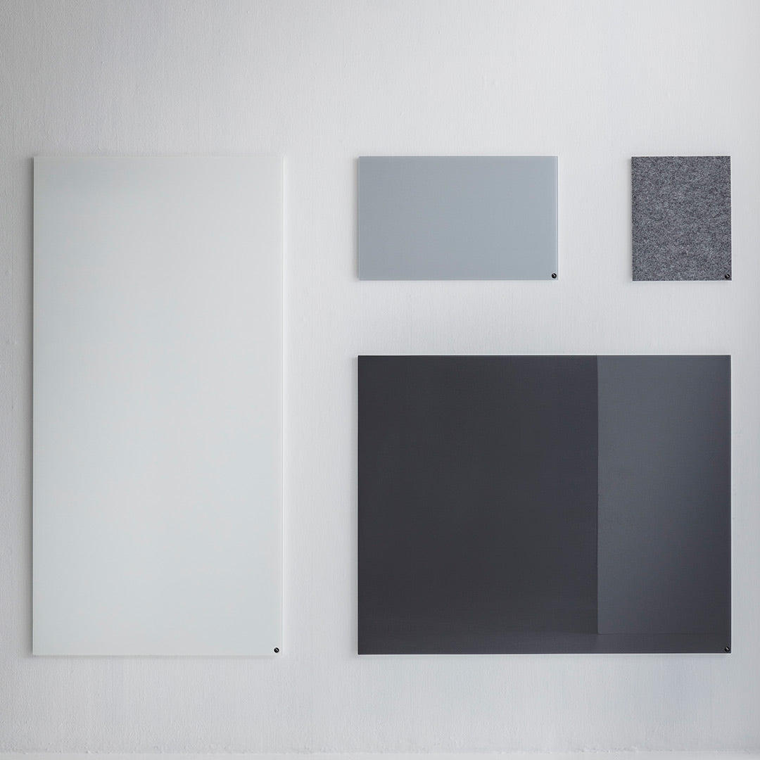 Collection of modern panels in light gray, dark gray, white, and textured patterns against a neutral background.