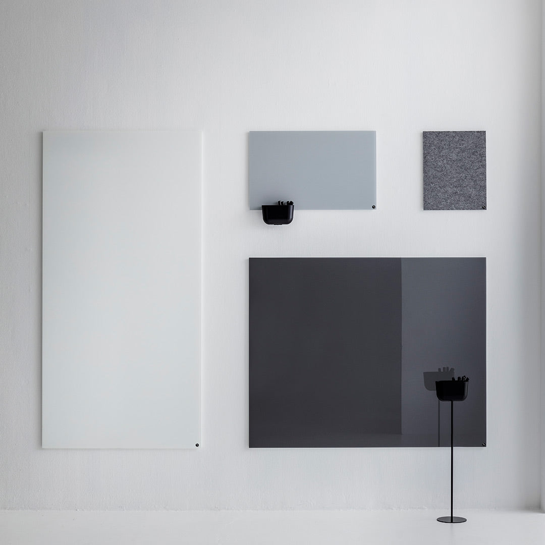 Collection of modern wall panels in white, light gray, and dark gray with smooth textures and sleek designs.