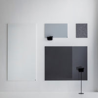 Collection of modern wall panels in white, light gray, and dark gray with smooth textures and sleek designs.