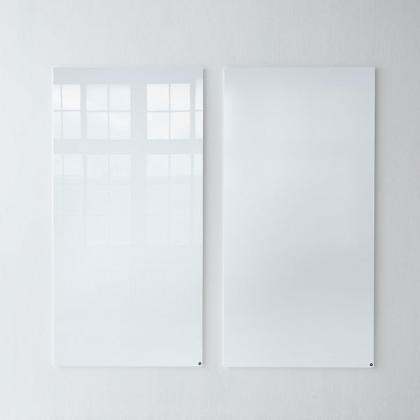 Glossy white wall panels with a sleek, reflective finish, featuring smooth surfaces and minimalistic design.