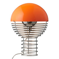 Modern lamp featuring an orange dome and spiral silver base, adding vibrant color and unique pattern to any space.