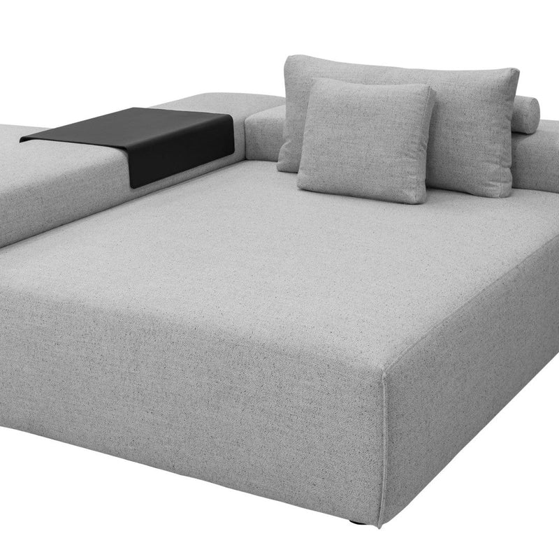 Gray sectional sofa with a sleek design, featuring a textured fabric and contrasting black armrest.