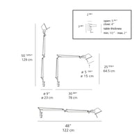 "White desk lamp with adjustable black arm and sleek metallic accents, featuring a minimalistic design."