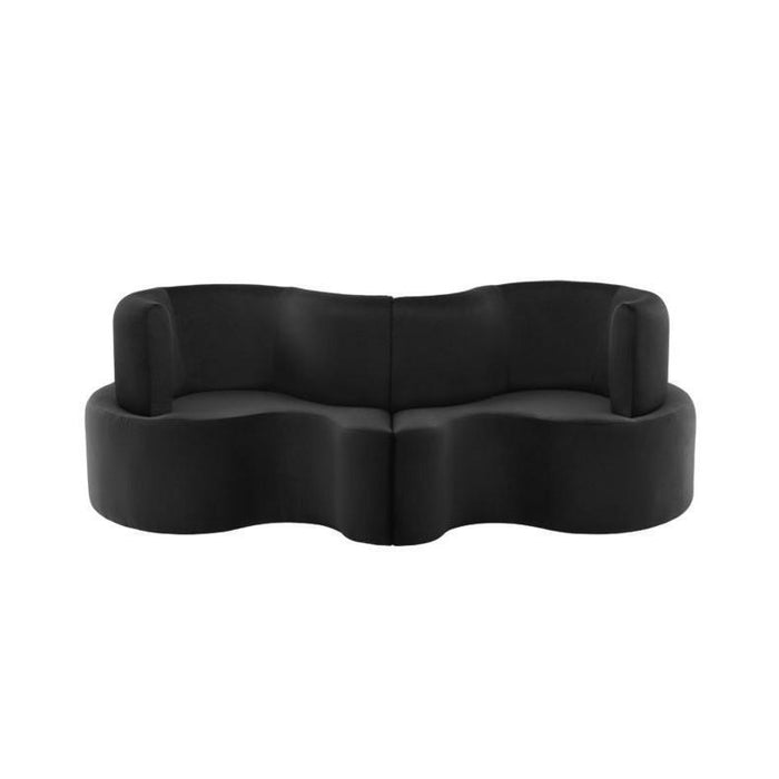 Black, rounded two-piece sofa with a smooth, minimalist design, enhancing modern interior aesthetics.