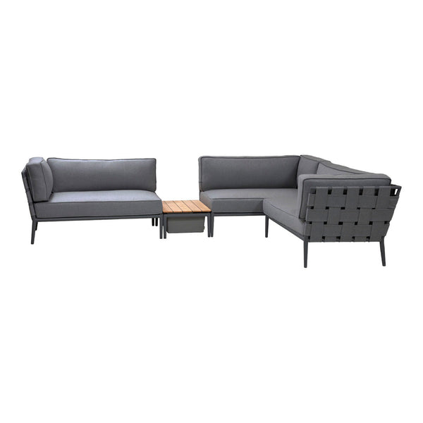 Modern gray sectional sofa with tufted upholstery and a wooden coffee table, ideal for outdoor or indoor settings.