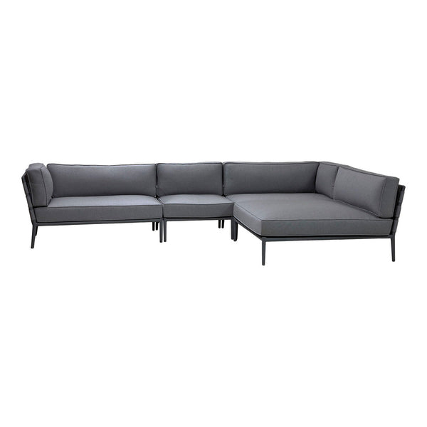 Gray upholstered sectional sofa with a sleek black metal frame, featuring a minimalist design.
