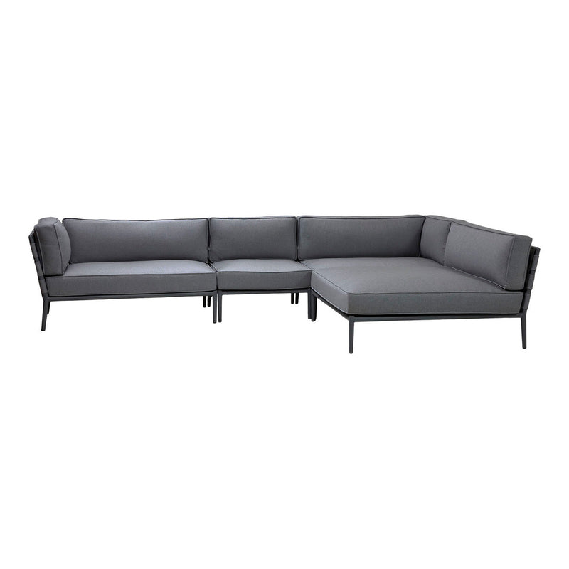Gray upholstered sectional sofa with a sleek black metal frame, featuring a minimalist design.