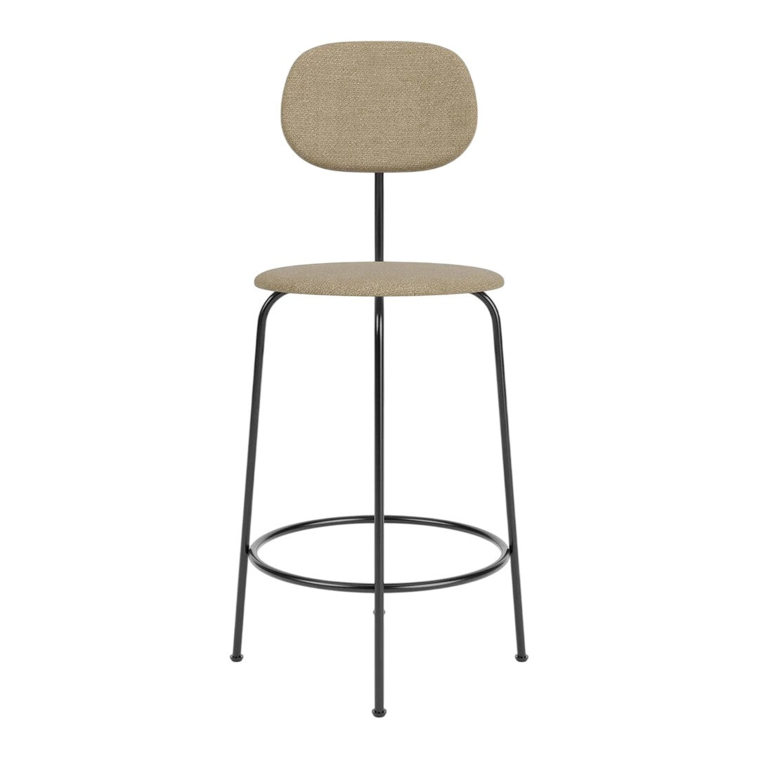 Tan fabric stool with a minimalist design and sleek black metal legs, perfect for modern spaces.