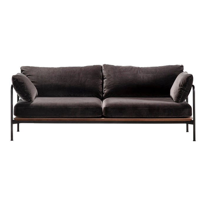 Stylish dark gray velvet sofa with sleek black metal frame and plush accent pillows, perfect for modern decor.