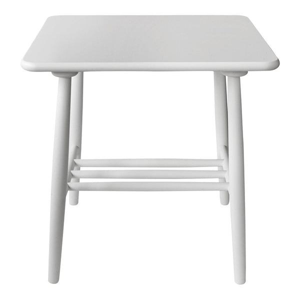 White square table with smooth surface and minimalist design, featuring light-colored wooden legs.