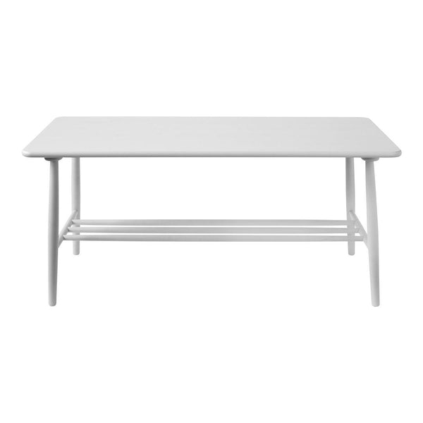 White rectangular coffee table with a smooth surface and minimalist design, featuring slender legs and a lower shelf.