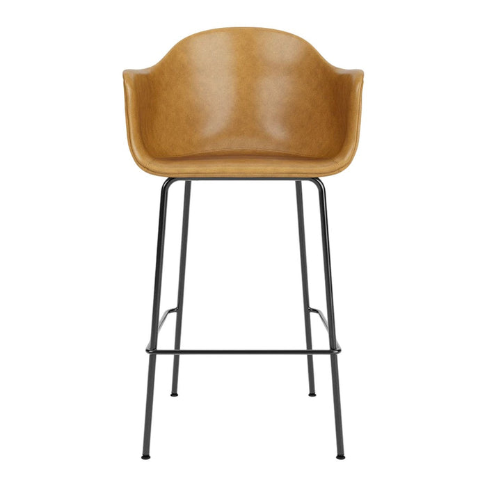 Brown leather bar stool with minimalist design and black metal legs. Perfect for modern and stylish spaces.