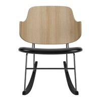 Wooden backrest with a light oak finish, black seat, and sleek metal frame, featuring a minimalist rocking chair design.