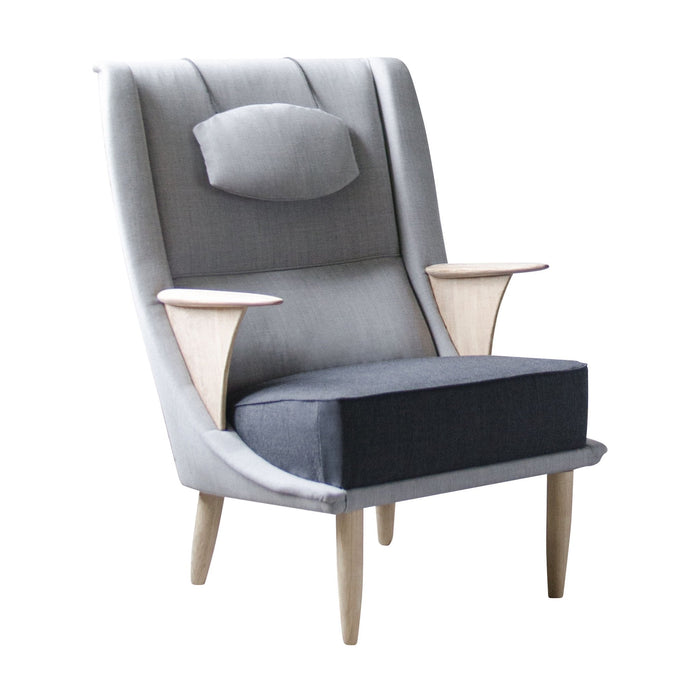Gray upholstered chair with wooden armrests and a sleek design, featuring contrasting textures and soft curves.