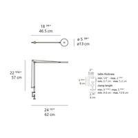 Sleek silver table lamp with a minimalist design, featuring a round shade and adjustable arm, ideal for modern decor.
