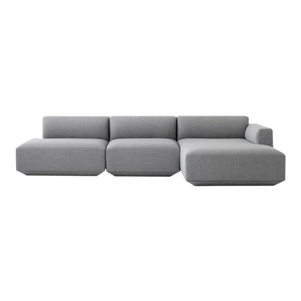 Modern grey sectional sofa with a minimalist design and smooth fabric upholstery. Ideal for contemporary living spaces.