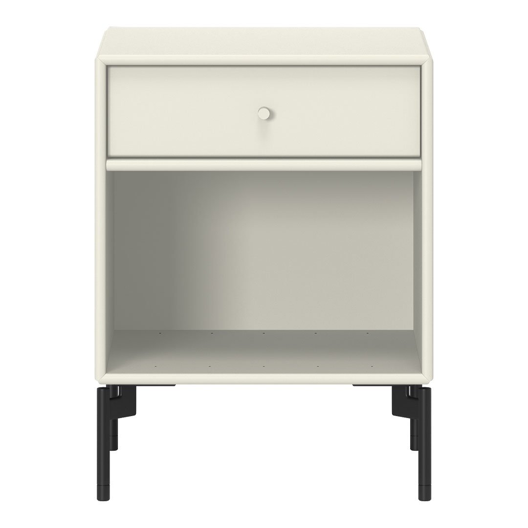 White nightstand with a minimalist design and black legs, featuring a smooth surface and functional drawer.