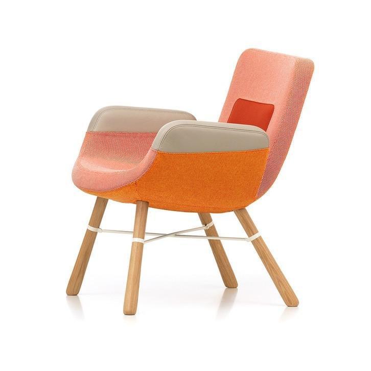 Modern chair featuring a gradient of coral, peach, and beige, with natural wood legs and sleek design.