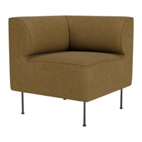 Brown upholstered corner chair with a smooth texture and minimalist design on metal legs. Perfect for modern spaces.