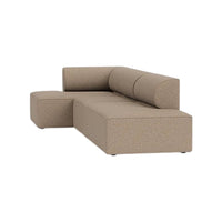 Tan sectional sofa with a textured, speckled fabric pattern, featuring a modern, minimalist design.