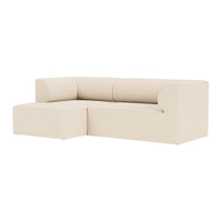 Beige sectional sofa with smooth, minimalist design and subtle curves, perfect for modern living spaces.