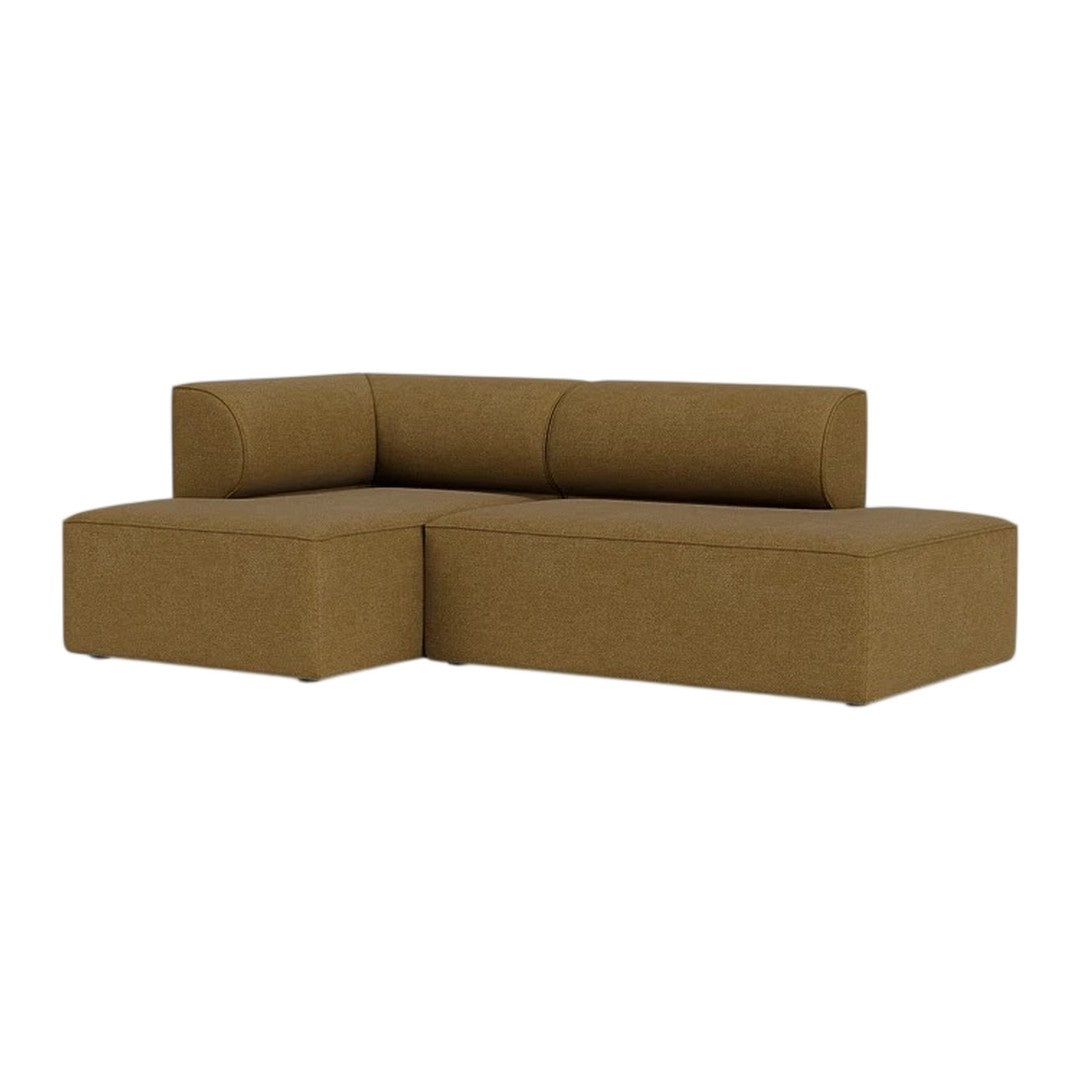 Brown sectional sofa with a smooth, textured finish, featuring sleek lines and a minimalist design. Perfect for modern decor.