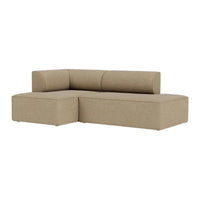 Beige fabric sectional sofa with a smooth texture and minimalist design, perfect for modern living spaces.
