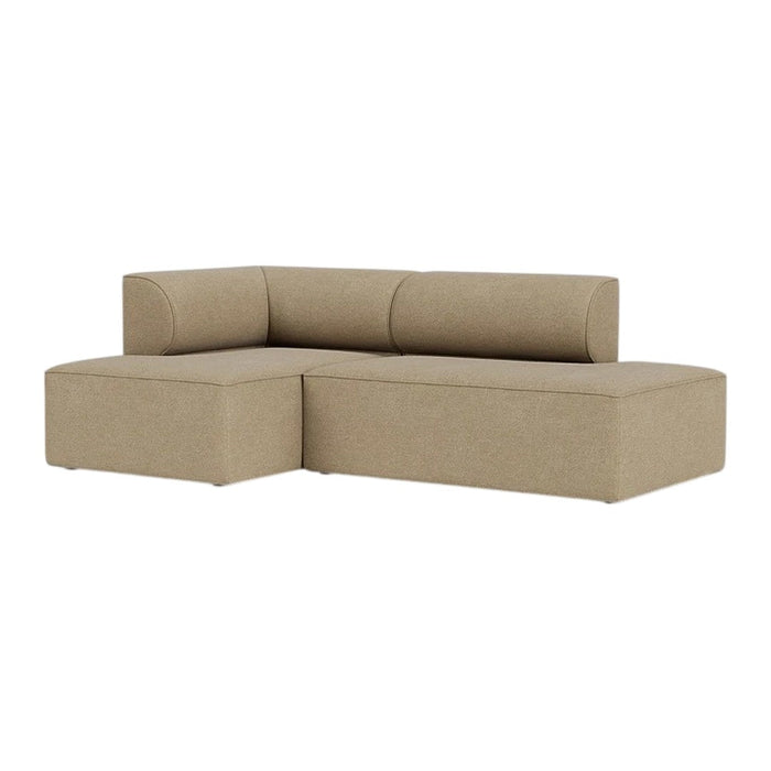 Beige fabric sectional sofa with a smooth texture and minimalist design, perfect for modern living spaces.