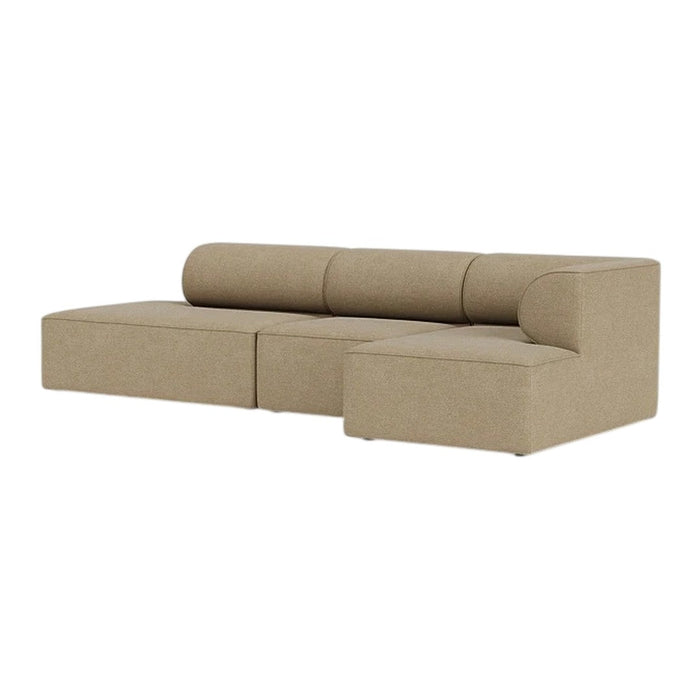 Beige modular sofa with a smooth, minimalist design and rounded backrest for a contemporary look.