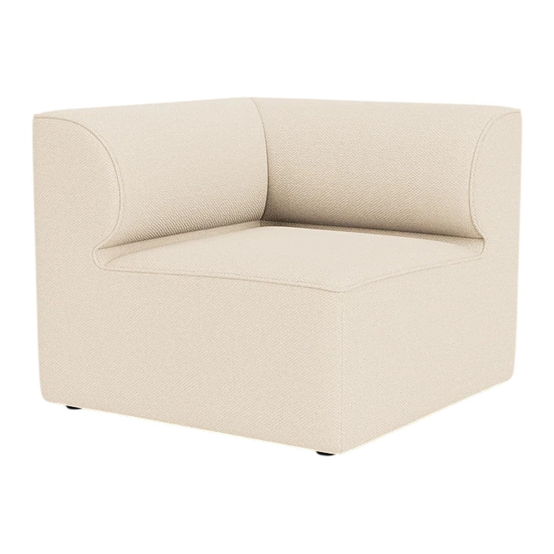 Olive green upholstered armchair with a minimalist design and smooth, curved armrest.