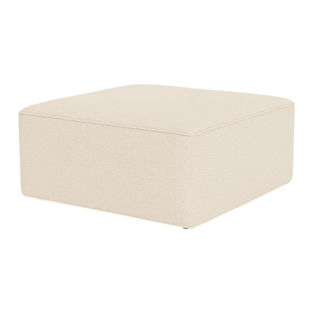Beige square ottoman with a smooth, textured surface, perfect for modern decor.