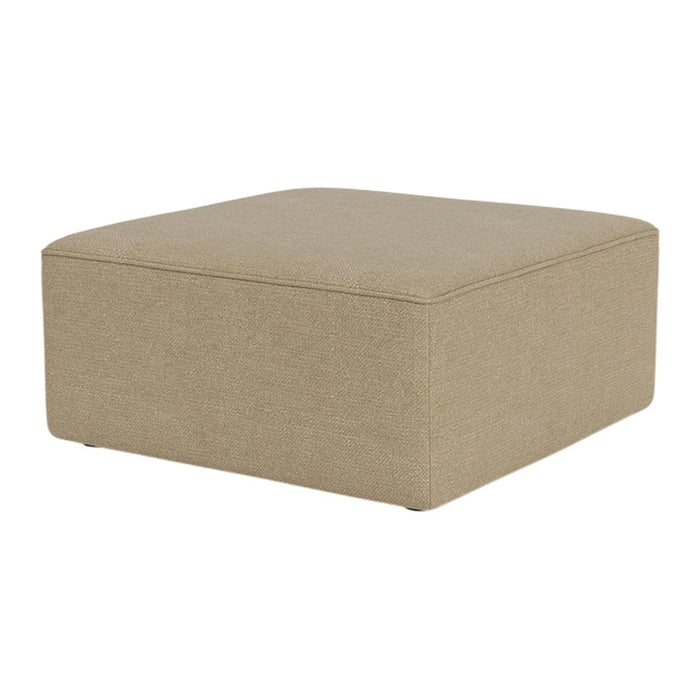 Beige square ottoman with a smooth, textured fabric and minimalist design, perfect for modern decor.