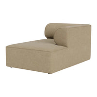 Beige chaise lounge with a minimalist design and clean lines, featuring a smooth, textured fabric finish.