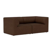 Gray textured sofa with a minimalist design, featuring a soft, speckled pattern and clean lines. Perfect for modern decor.