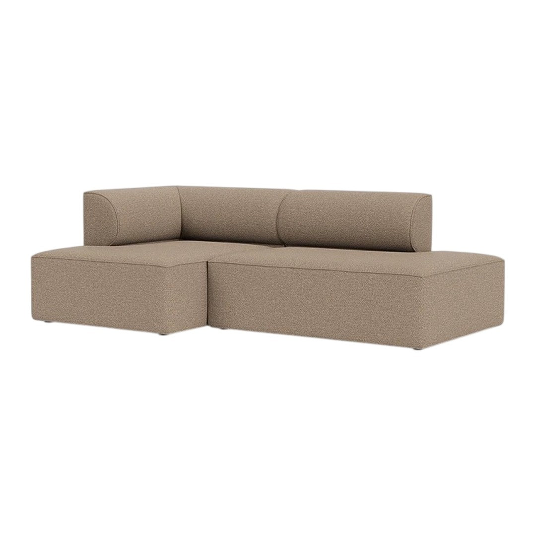 Beige sectional sofa with a smooth, textured fabric featuring minimalist design and clean lines.