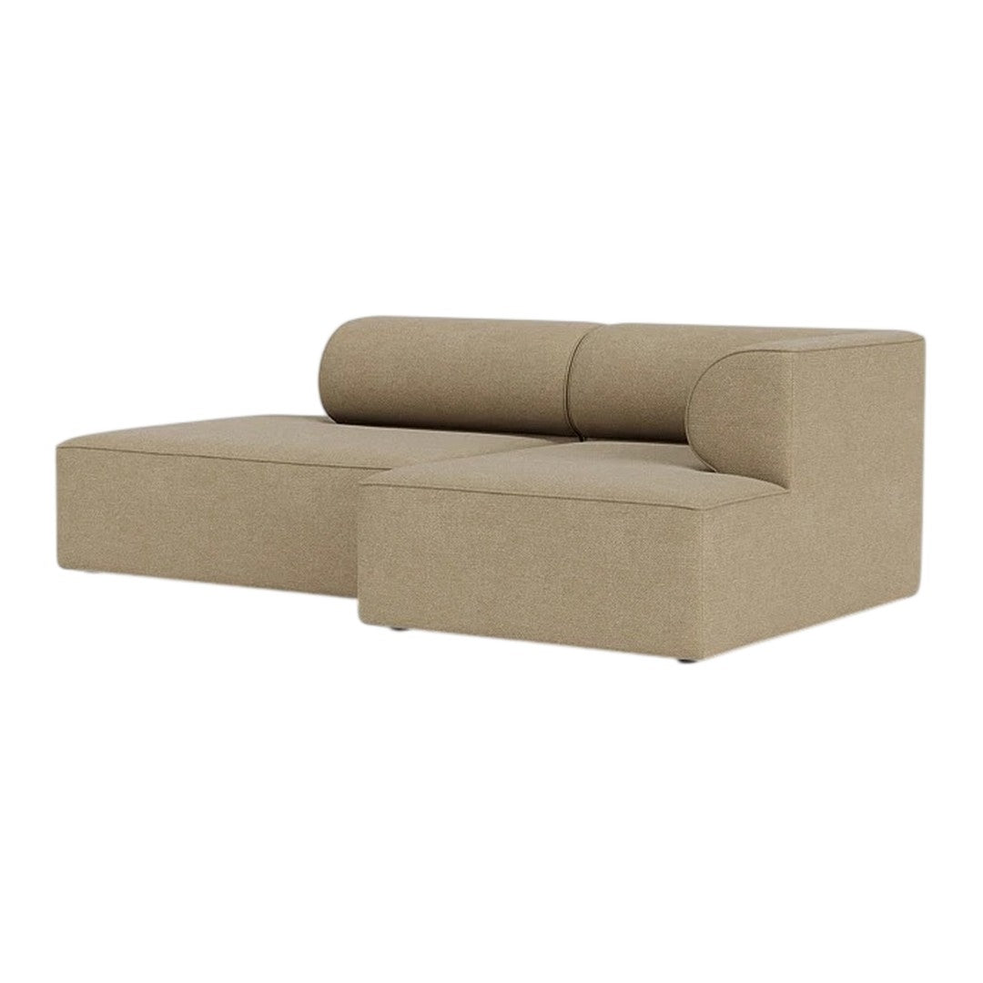 Beige sectional sofa with smooth fabric and simple, modern design. Perfect for minimalist or contemporary decor.