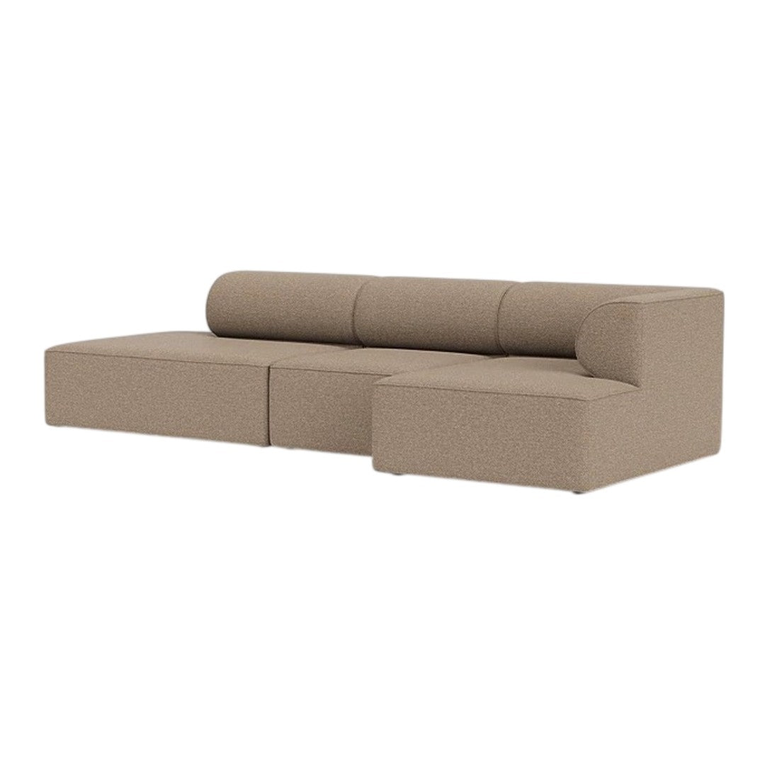 Tan modular sofa with a smooth, textured fabric and minimalist design, featuring a round backrest and clean lines.