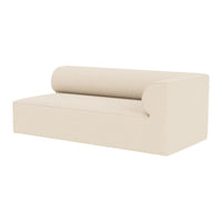 Beige modern sofa with a minimalist design and smooth, clean lines, featuring a rounded back and side.