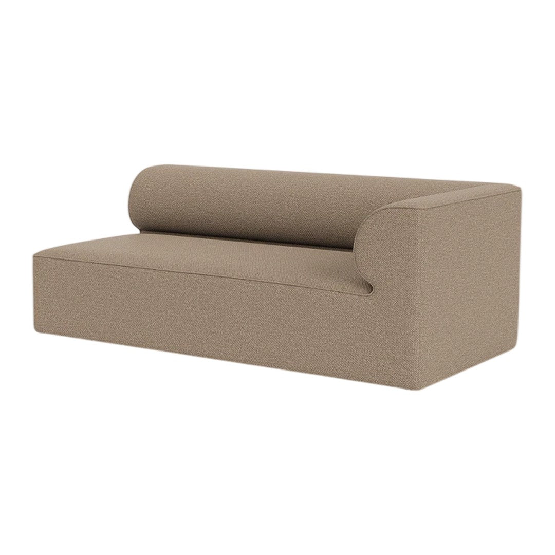Tan fabric sofa with a modern, minimalist design featuring a smooth texture and a cylindrical back cushion.