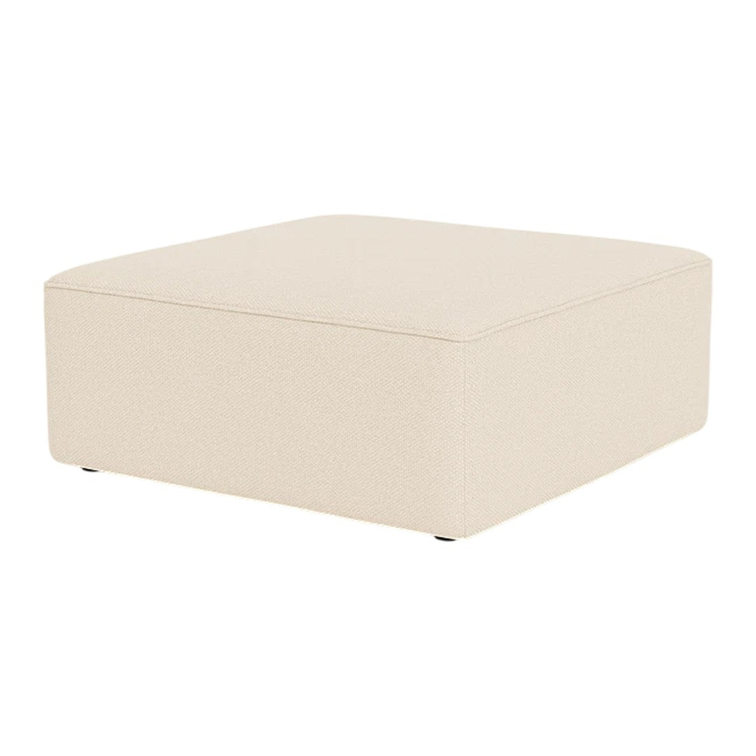 Beige square ottoman with a smooth surface and clean lines, perfect for modern decor.