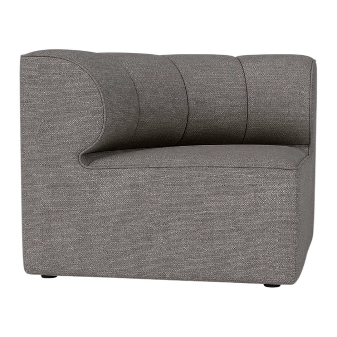 Gray upholstered chair with a smooth texture and curved design, featuring subtle ribbed detailing.