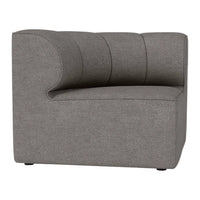 Gray upholstered chair with a smooth texture and curved design, featuring subtle ribbed detailing.