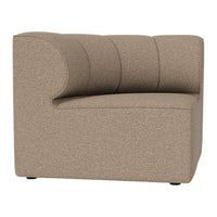 Beige textured upholstery with subtle ribbed pattern on a modern, curved armchair design.