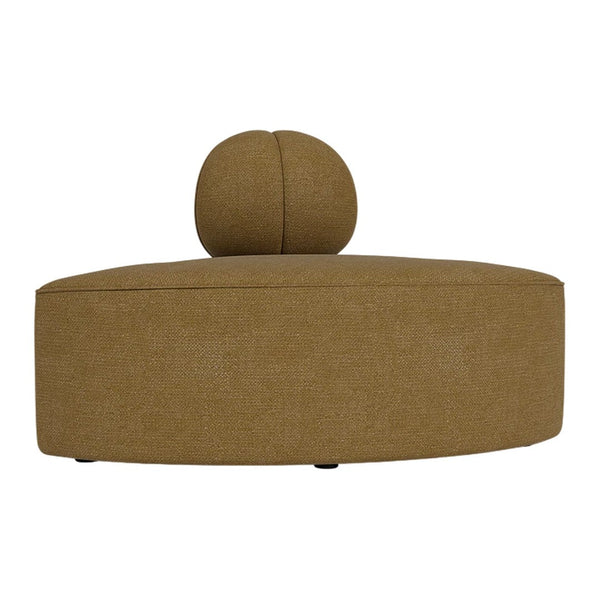 Brown upholstered ottoman with a round top and minimalist design, featuring a smooth texture. Ideal for modern decor.