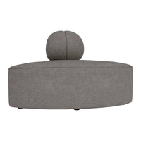 Stylish gray ottoman with a round top cushion, featuring a sleek, modern design and textured fabric surface.
