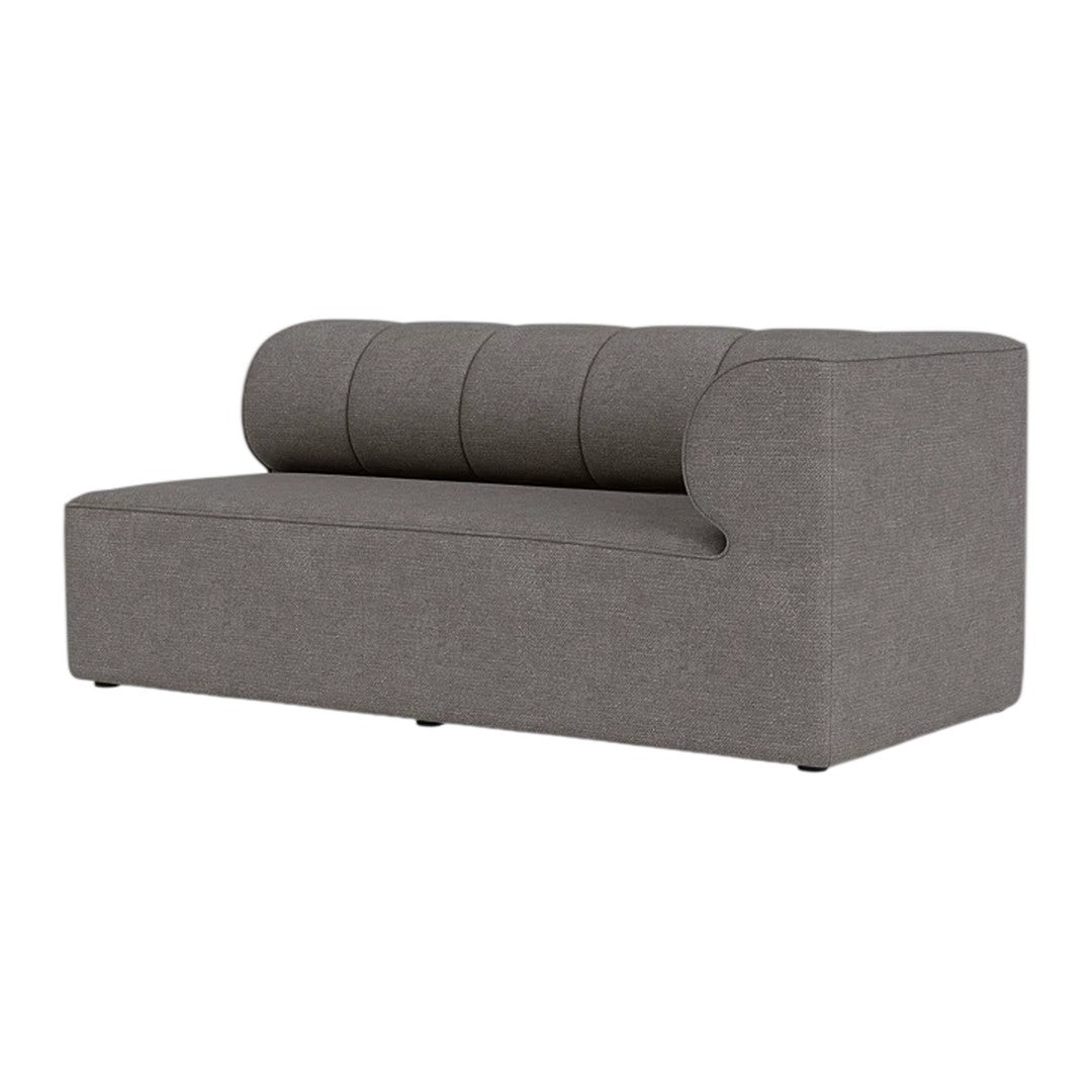 Gray sofa with tufted backrest, clean lines, and minimalist design, perfect for modern interiors.