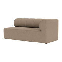 Textured beige sofa with a curved back and three cushioned segments, blending modern design with neutral tones.