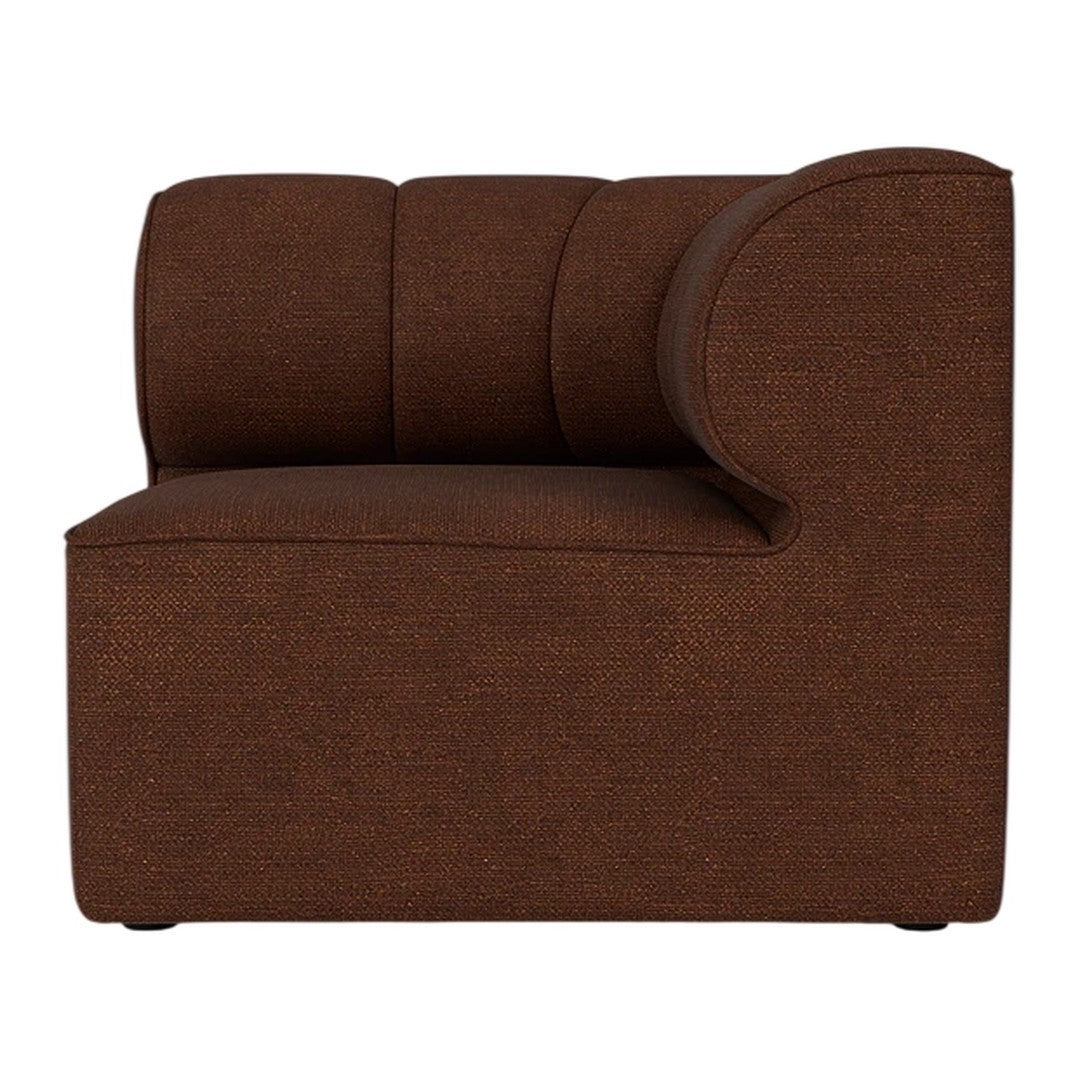 Brown upholstered corner chair with textured fabric and curved back design. Perfect for modern home décor.