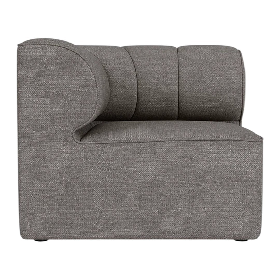 Gray upholstered chair with a smooth, textured fabric and curved design, offering a modern aesthetic.