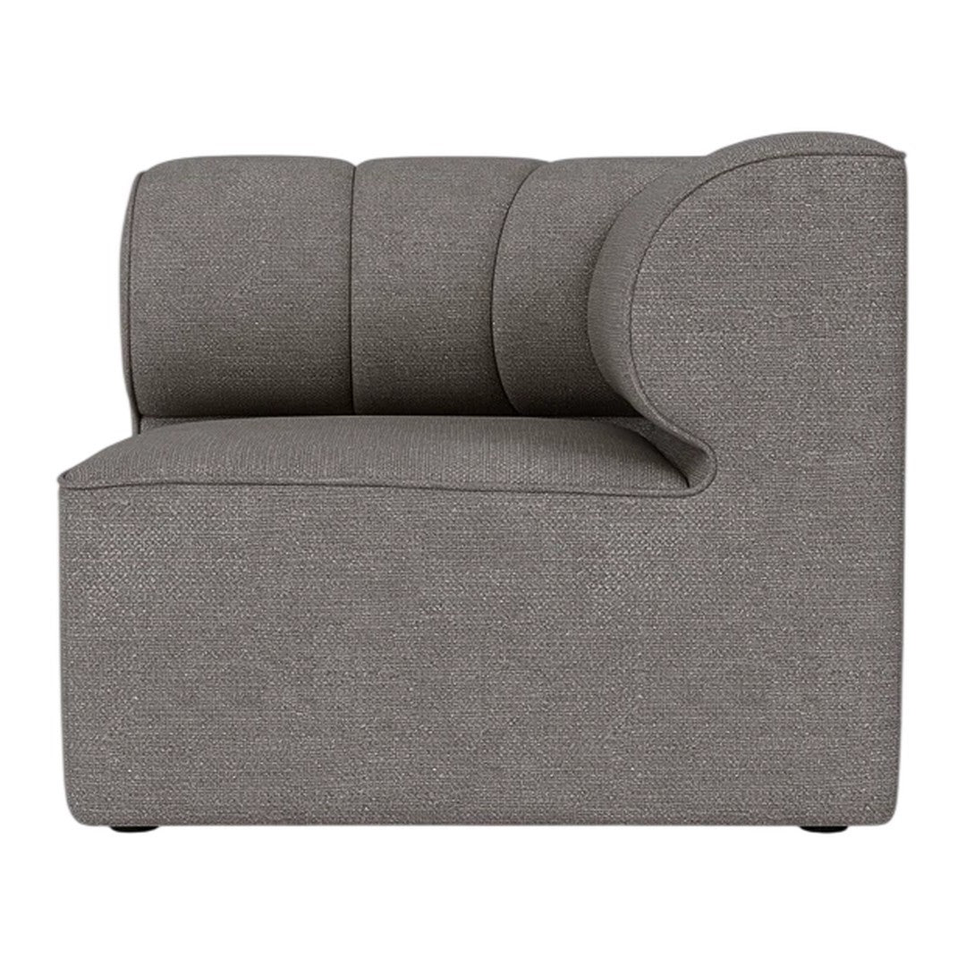 Gray upholstered sofa with modern curved design and subtle textured pattern. Perfect for contemporary interiors.
